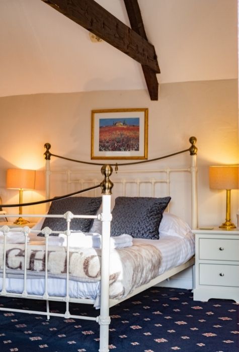 The Place To Stay, Knoll Hill Farm, Stylish Boutique Bed and Breakfast Guest House Accommodation For The Perfect Staycation & holiday. Room 4 En-Suite Deluxe King Sleeps 2 + 2. This spacious deluxe king-sized room with its original beams looks out onto a central courtyard with its own external entrance, allowing for good social distancing from other guests. It is large enough to accommodate two further cots or beds (suitable for children up to 12 years old) to make a nice, cosy family unit. The Place To Stay, Knoll Hill Farm, Stylish Boutique Bed and Breakfast Guest House Accommodation For The Perfect Staycation & holiday. Room 4 En-Suite Deluxe King Sleeps 2 + 2. This spacious deluxe king-sized room with its original beams looks out onto a central courtyard with its own external entrance, allowing for good social distancing from other guests. It is large enough to accommodate two further cots or beds (suitable for children up to 12 years old) to make a nice, cosy family unit.